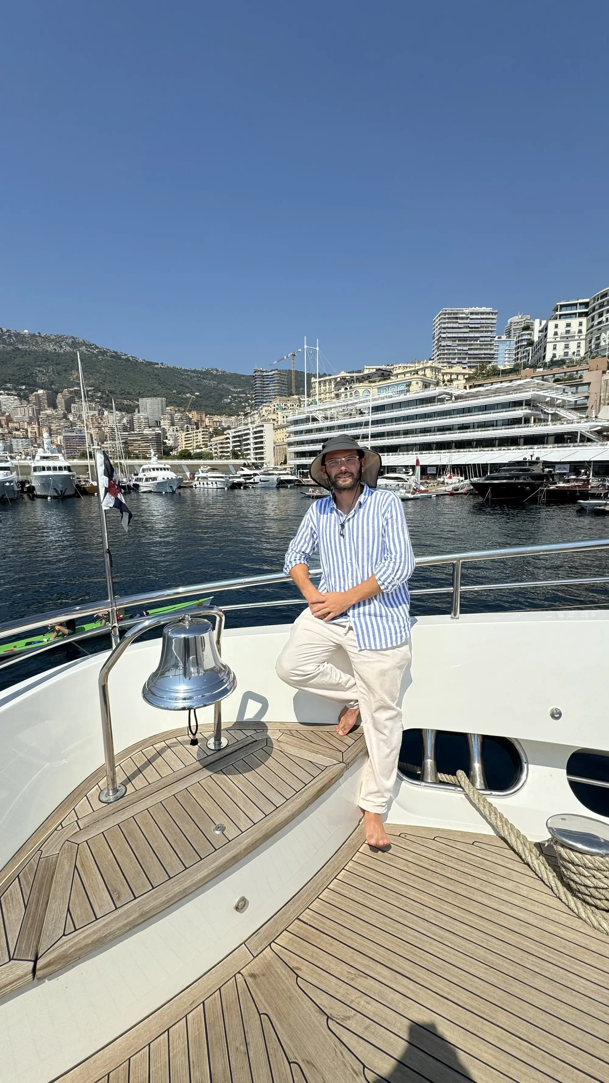 Anestis Tsamouridis on the bow of a motor yacht in Monaco